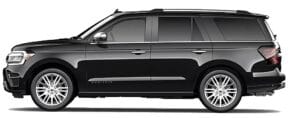 Side view of a Ford Expedition showcasing its bold design, spacious body, and rugged features."